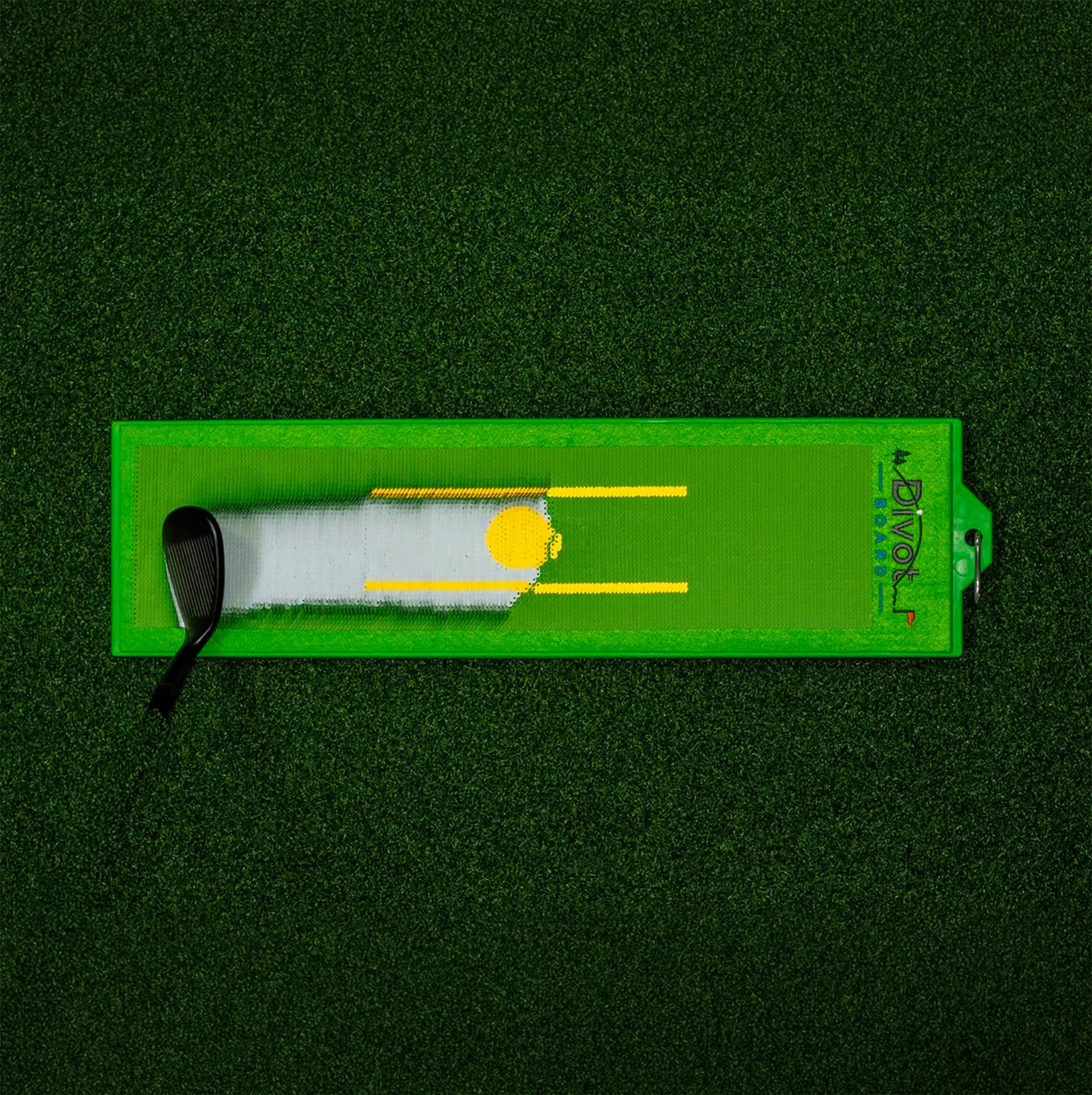 Divot Board on turf, showing the mark left by a club strike